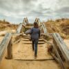 woman walking on stairs during daytime