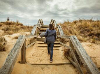 woman walking on stairs during daytime