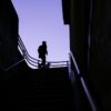 a man walking up a flight of stairs