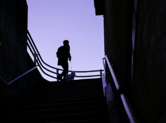 a man walking up a flight of stairs