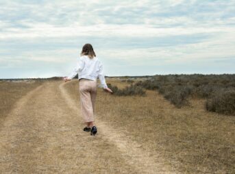 a man walking in a field