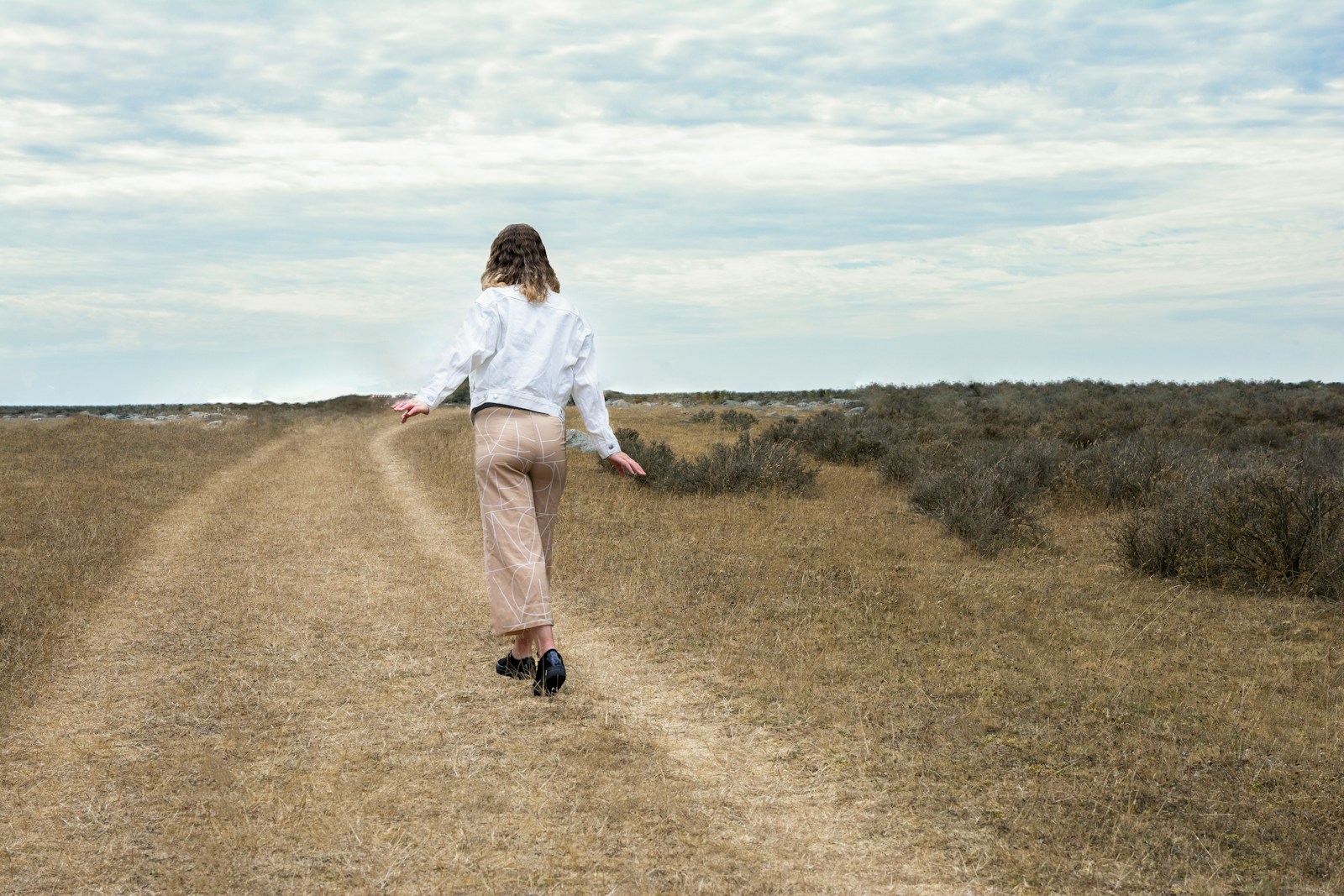 a man walking in a field