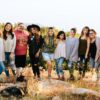 group of women standing on rock fragment